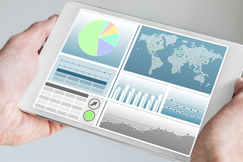 IT Performance Monitoring Picture 49809154 - business man holding modern tablet with both hands with business dashboard in neutral color